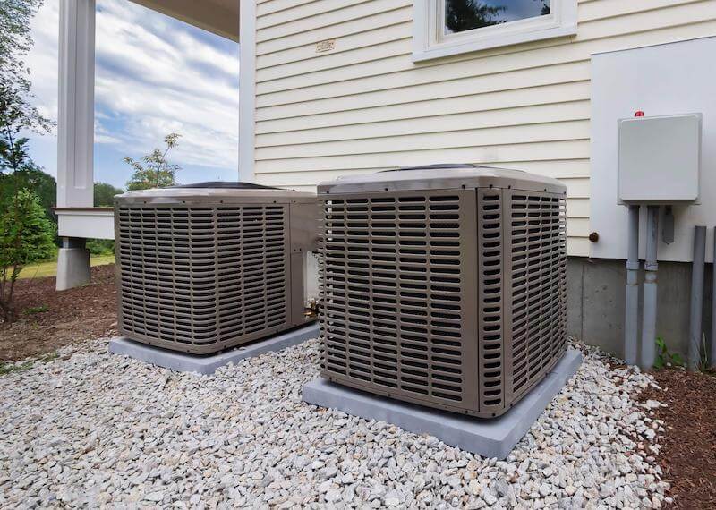 HVAC technician servicing an air conditioning unit in Renton Highlands, WA